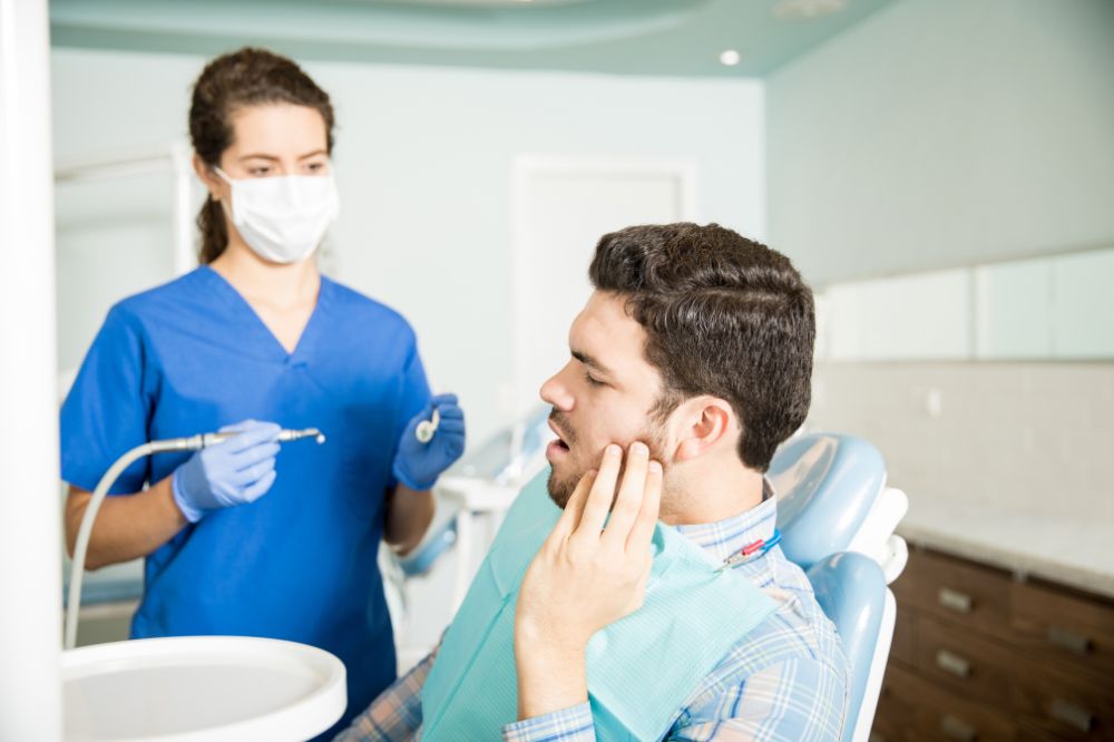a man is getting emergency dental treatment